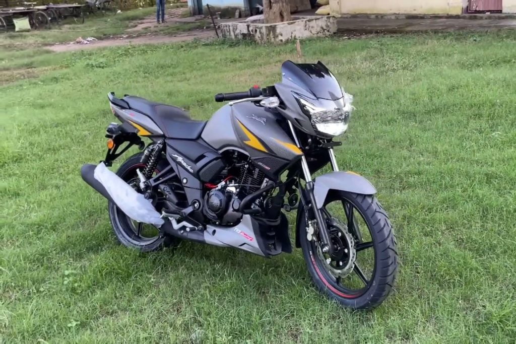 TVS Apache rtr 160 BS6 2023 front right quarter view shown with led headlights in turned on position.